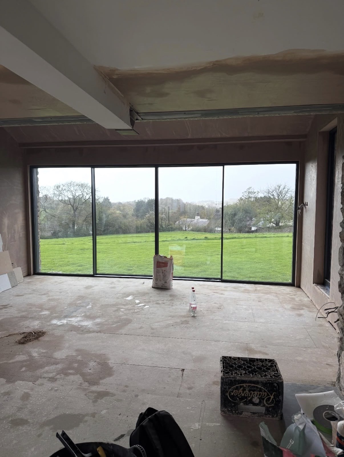 Smooth freshly plastered interior with large window